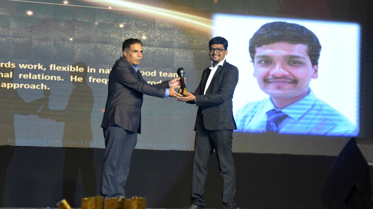 Abhishek receiving an award on stage